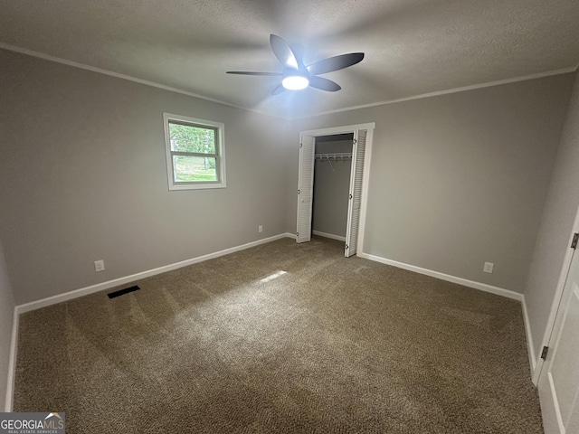 490 Piedmont Hwy, Centre, AL 35960 - unfurnished bedroom featuring crown molding, carpet floors, a closet, a textured ceiling, and ceiling fan