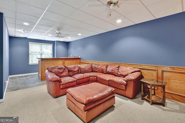 carpeted living room with baseboards, ceiling fan, recessed lighting, and a paneled ceiling