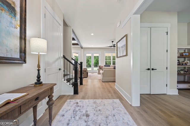 entrance foyer featuring stairs, recessed lighting, french doors, and light wood-style floors