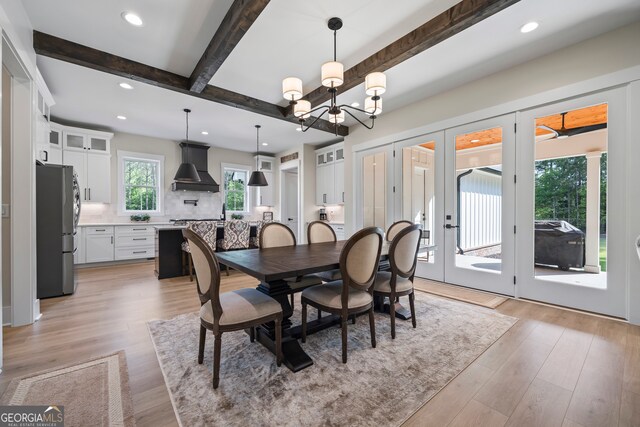 dining space with light wood-style floors, recessed lighting, a chandelier, and beamed ceiling