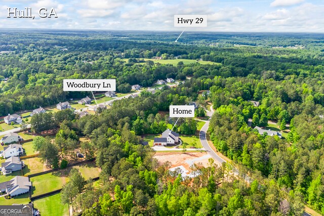 bird's eye view featuring a residential view and a view of trees
