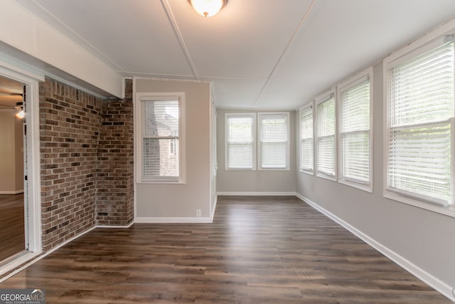 2814 Brackenwood Dr, Snellville, GA 30039 - unfurnished sunroom with brick wall and wood finished floors