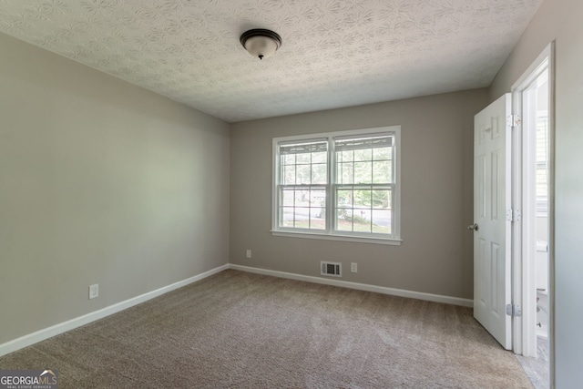 2814 Brackenwood Dr, Snellville, GA 30039 - unfurnished bedroom with carpet flooring and a textured ceiling