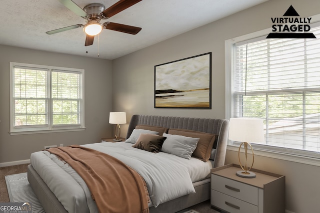 2814 Brackenwood Dr, Snellville, GA 30039 - carpeted bedroom with multiple windows and a ceiling fan