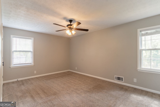 2814 Brackenwood Dr, Snellville, GA 30039 - empty room featuring a ceiling fan, light colored carpet, and a textured ceiling