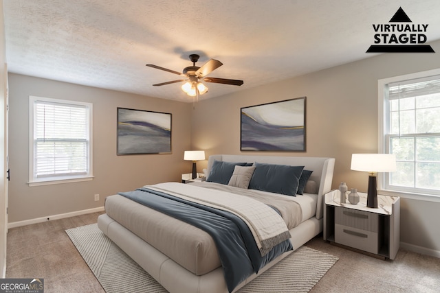 2814 Brackenwood Dr, Snellville, GA 30039 - bedroom featuring multiple windows, light carpet, and ceiling fan