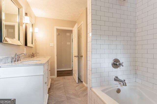 2814 Brackenwood Dr, Snellville, GA 30039 - bathroom featuring double vanity and  shower combination
