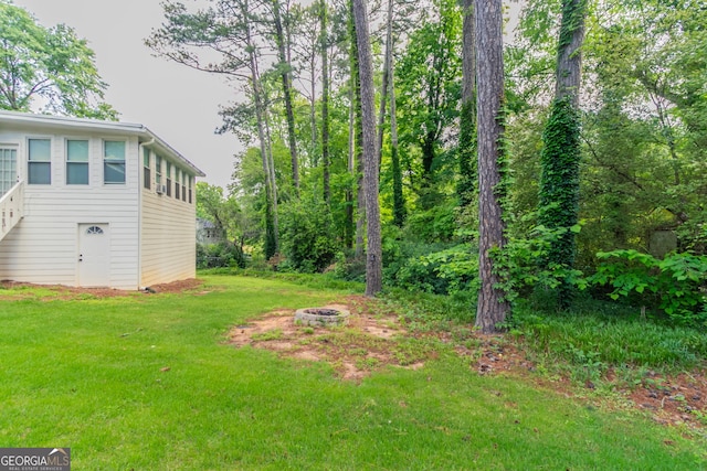 2814 Brackenwood Dr, Snellville, GA 30039 - view of green lawn with a fire pit
