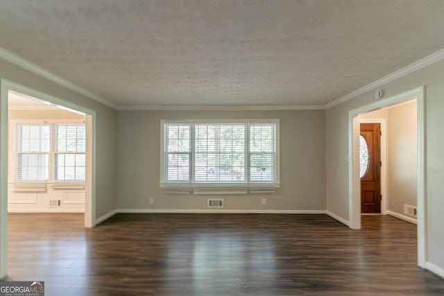 2814 Brackenwood Dr, Snellville, GA 30039 - empty room with dark wood-style floors, ornamental molding, and a textured ceiling