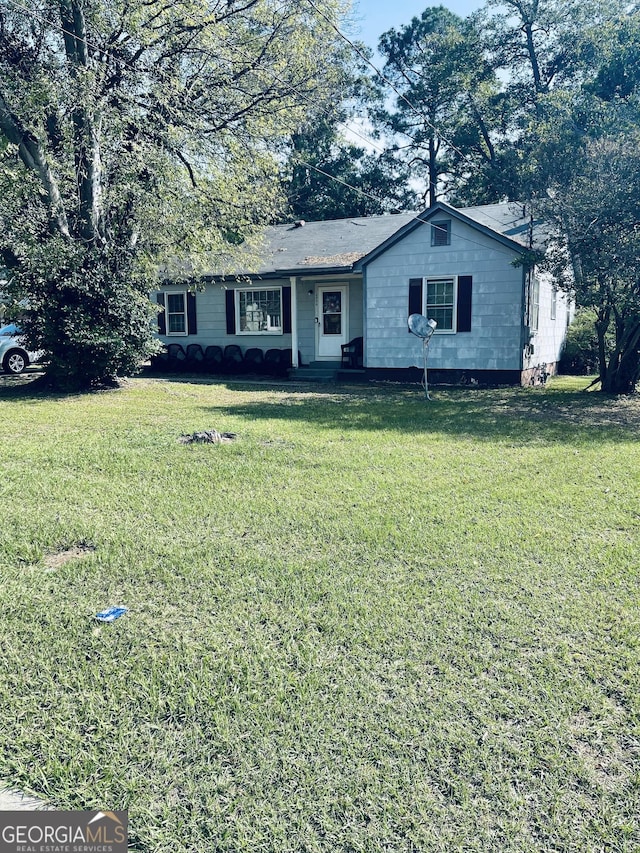 ranch-style home with a front yard