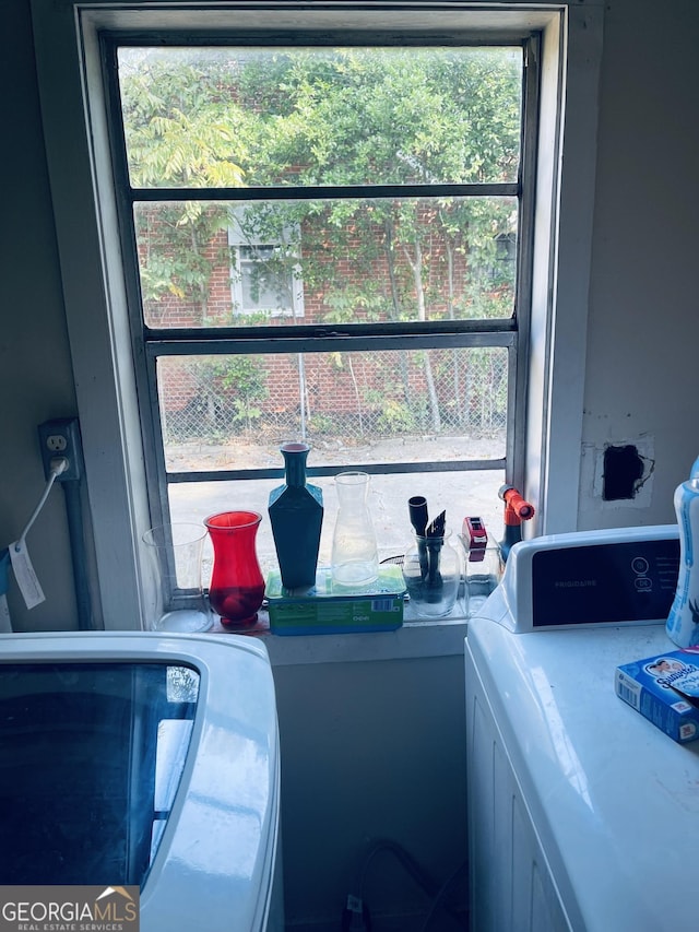 laundry room with plenty of natural light, laundry area, and washer / clothes dryer