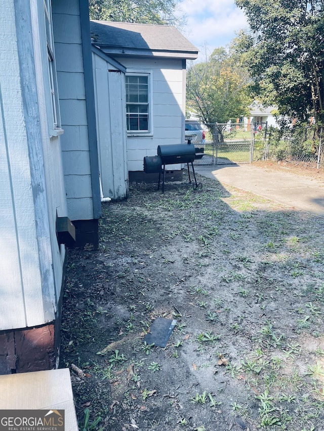 view of yard with fence and a gate