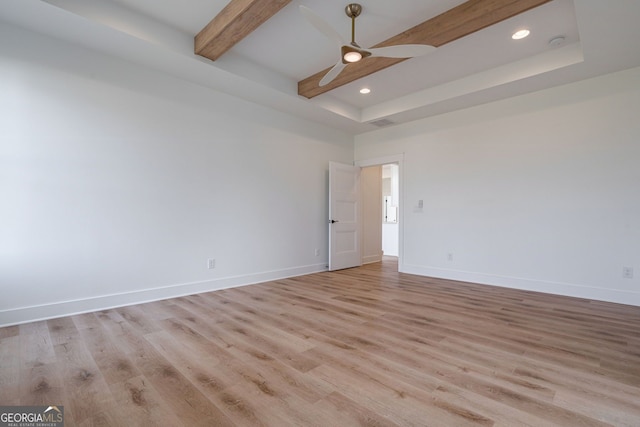 empty room featuring baseboards, ceiling fan, and light wood finished floors