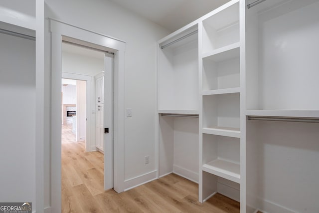 walk in closet featuring light wood-type flooring