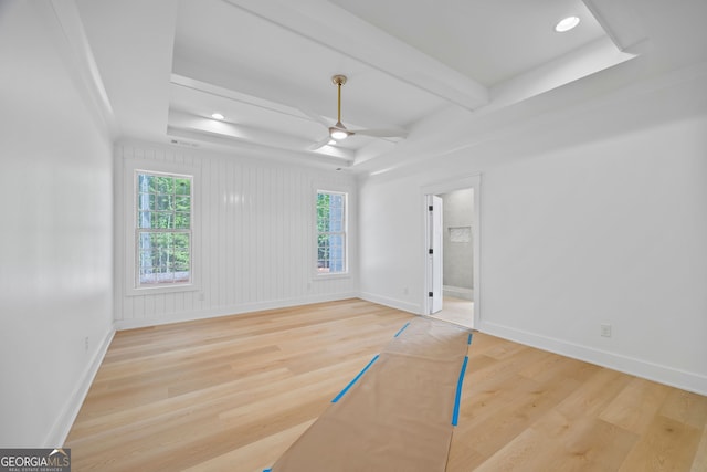 4751 H D Atha Rd, Covington, GA 30014 - unfurnished bedroom with light wood-style floors, ceiling fan, recessed lighting, connected bathroom, and a tray ceiling