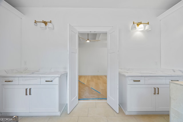 4751 H D Atha Rd, Covington, GA 30014 - full bath with two vanities, tile patterned flooring, and ceiling fan