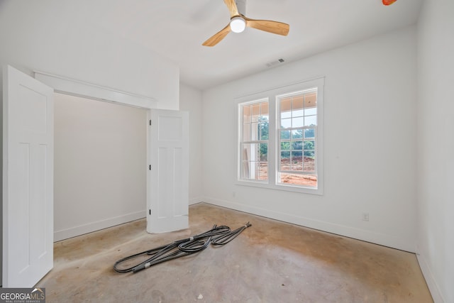 4751 H D Atha Rd, Covington, GA 30014 - spare room featuring unfinished concrete flooring and ceiling fan