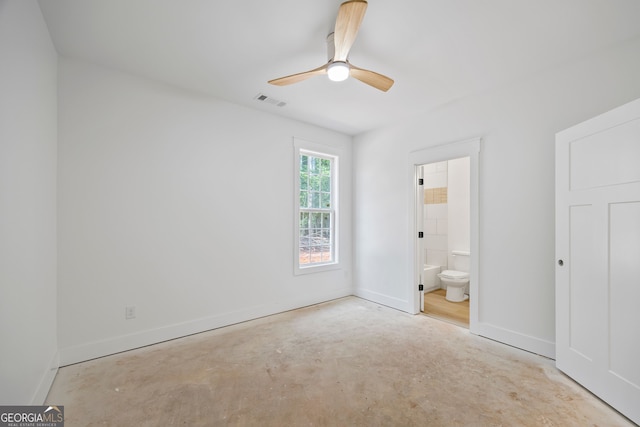 4751 H D Atha Rd, Covington, GA 30014 - unfurnished bedroom featuring unfinished concrete floors, connected bathroom, and a ceiling fan