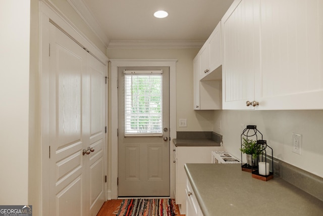 doorway featuring crown molding