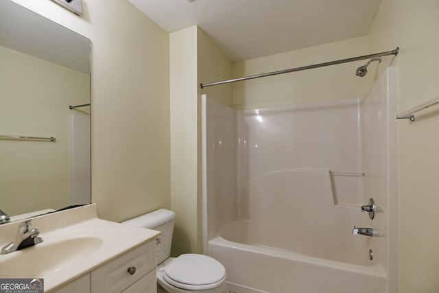 bathroom featuring shower / bathtub combination, toilet, and vanity