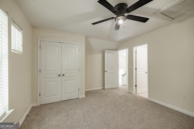 unfurnished bedroom with a ceiling fan, baseboards, carpet, and a closet