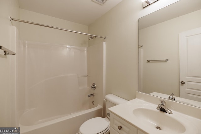 bathroom with toilet, washtub / shower combination, and vanity
