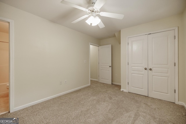 unfurnished bedroom with carpet floors, baseboards, a closet, and ceiling fan