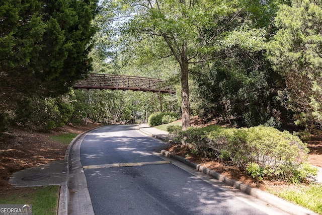 view of street with curbs