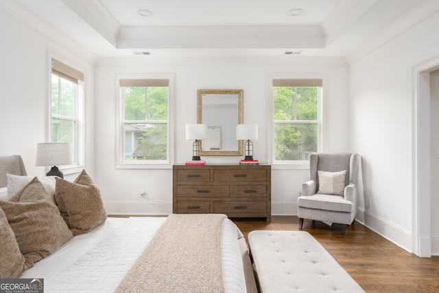 bedroom with baseboards, visible vents, dark wood-style floors, and a raised ceiling