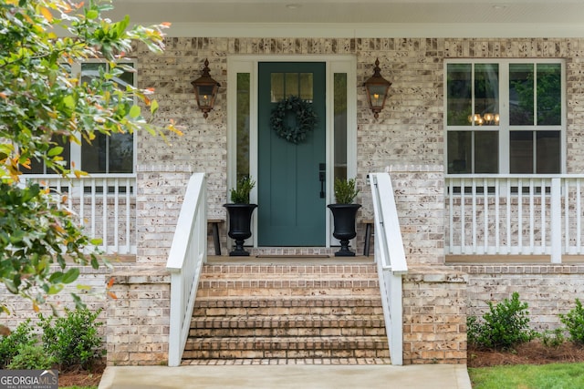 doorway to property featuring covered porch