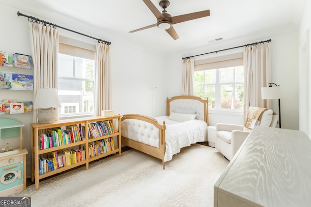 bedroom with visible vents and a ceiling fan