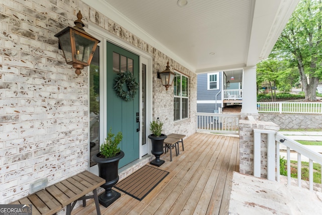 wooden terrace with a porch