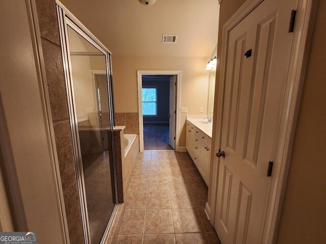 10856 Ellicot Way, Alpharetta, GA 30022 - full bath featuring a shower stall, vanity, a bath, and tile patterned floors
