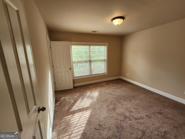 10856 Ellicot Way, Alpharetta, GA 30022 - empty room featuring carpet and baseboards