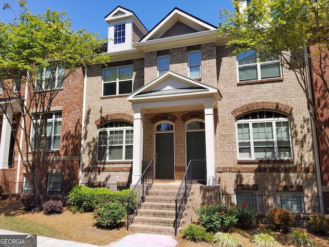10856 Ellicot Way, Alpharetta, GA 30022 - view of front of home with brick siding and fence