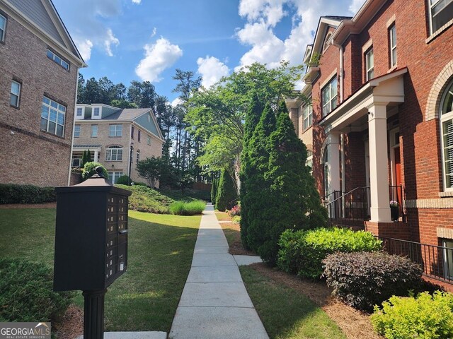 10856 Ellicot Way, Alpharetta, GA 30022 - view of home's community with mail area and a yard