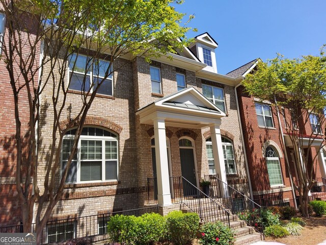 10856 Ellicot Way, Alpharetta, GA 30022 - townhome / multi-family property featuring brick siding
