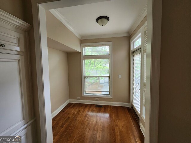 10856 Ellicot Way, Alpharetta, GA 30022 - empty room featuring dark wood-style floors, baseboards, and ornamental molding