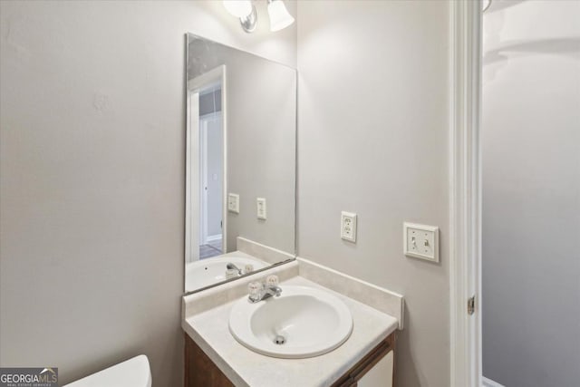 half bath with toilet and vanity