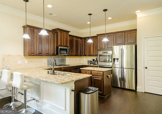 kitchen featuring visible vents, a peninsula, dark brown cabinets, light stone countertops, and appliances with stainless steel finishes