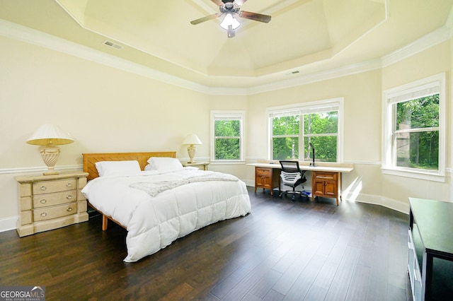 bedroom featuring dark wood-style flooring, baseboards, visible vents, and a raised ceiling