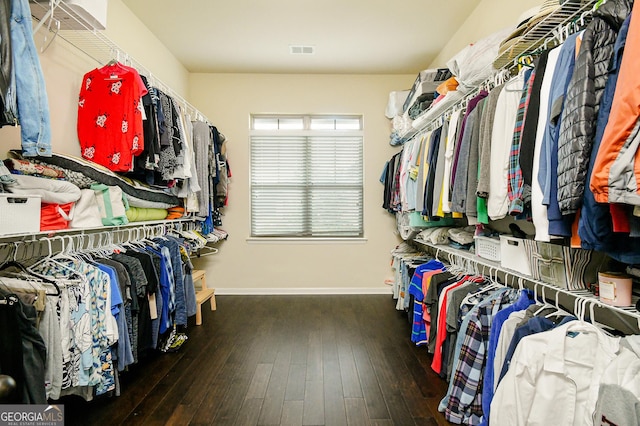 walk in closet with hardwood / wood-style flooring and visible vents