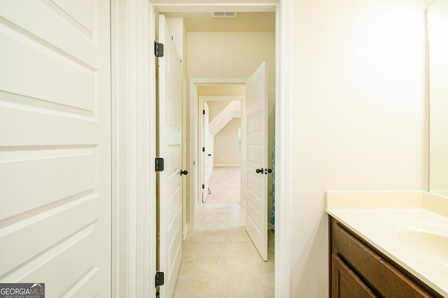bathroom featuring visible vents, tile patterned flooring, and vanity
