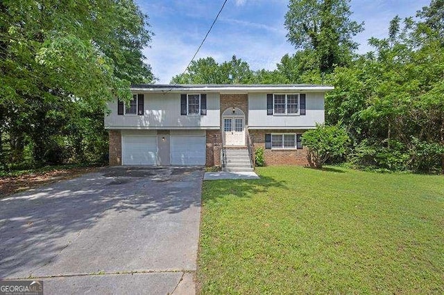 3929 Emerald Springs Ct, Decatur, GA 30035 - split foyer home with a garage, a front yard, driveway, and brick siding