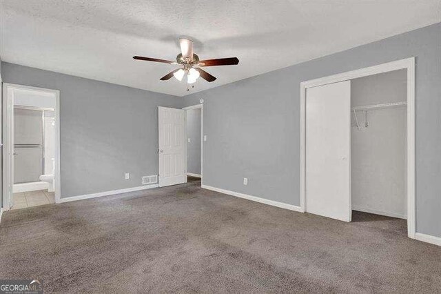 3929 Emerald Springs Ct, Decatur, GA 30035 - unfurnished bedroom with carpet floors, baseboards, visible vents, and a closet