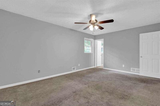 3929 Emerald Springs Ct, Decatur, GA 30035 - spare room with a ceiling fan, baseboards, visible vents, and carpet