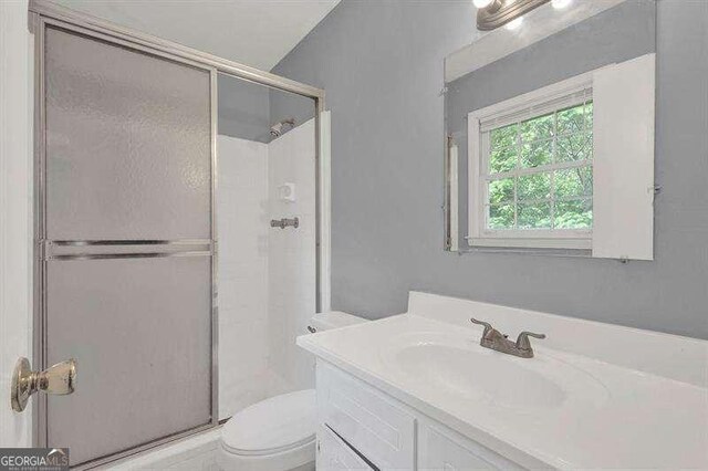 3929 Emerald Springs Ct, Decatur, GA 30035 - bathroom with an enclosed shower, toilet, and vanity