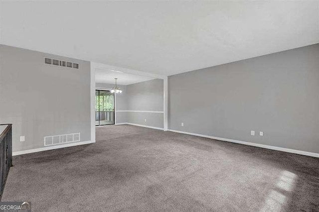3929 Emerald Springs Ct, Decatur, GA 30035 - unfurnished room with a notable chandelier, visible vents, baseboards, and carpet
