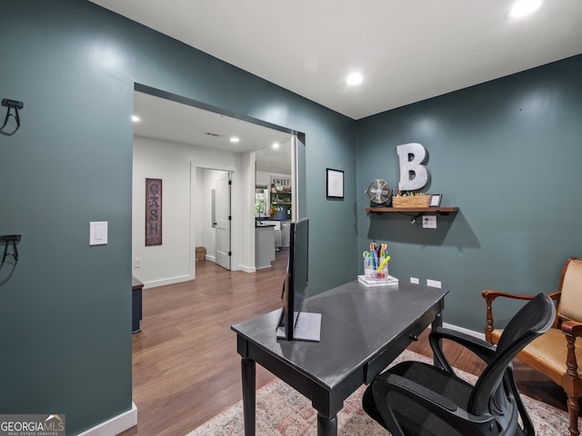 office with recessed lighting, baseboards, and wood finished floors