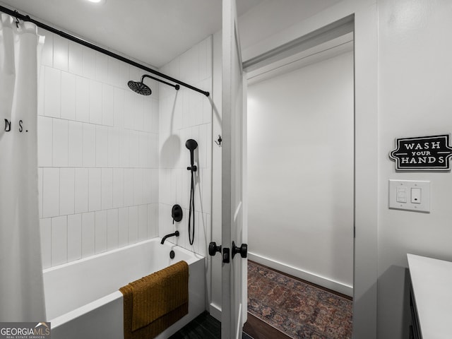 full bathroom featuring baseboards and shower / bath combination with curtain